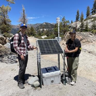 2 students with air quality monitor in Devils Postpile National Park