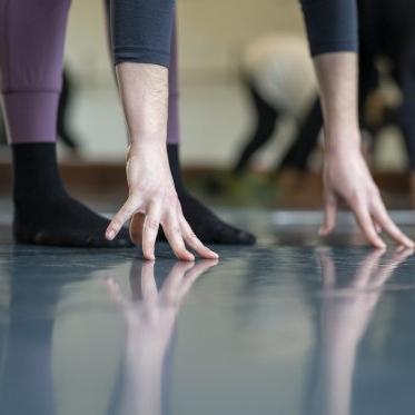 Dancers hands and feet on floor