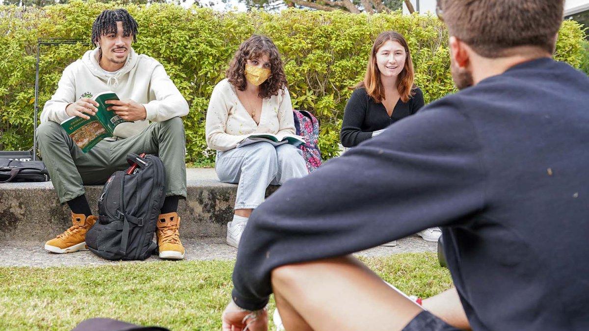 Students listen during outdoor class